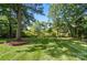 Expansive lawn area with mature trees offering a park-like setting at 4323 Crow Rd, Monroe, NC 28112