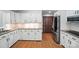 Well-lit kitchen with white cabinetry, granite countertops, and stainless steel refrigerator at 4323 Crow Rd, Monroe, NC 28112