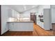 Spacious kitchen with white cabinets, granite countertops, and stainless steel appliances at 4323 Crow Rd, Monroe, NC 28112