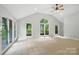 Living room with a vaulted ceiling and a garden view at 4323 Crow Rd, Monroe, NC 28112