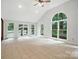 Living room with a vaulted ceiling and a garden view at 4323 Crow Rd, Monroe, NC 28112