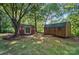 Two storage sheds on the property, providing ample space for tools and equipment in a private, wooded setting at 4323 Crow Rd, Monroe, NC 28112