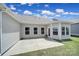 Backyard with patio, green grass and a beautiful house at 440 Shallowford Dr, Rock Hill, SC 29732