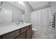 Functional bathroom showcasing a vanity with solid surface countertops, a shower and tub at 440 Shallowford Dr, Rock Hill, SC 29732