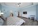 Bright bedroom with hardwood floors, ceiling fan, and access to the en-suite bathroom at 440 Shallowford Dr, Rock Hill, SC 29732