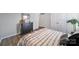 Bedroom with neutral walls, wood floors, a dresser, and closets at 440 Shallowford Dr, Rock Hill, SC 29732
