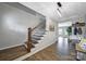 Stylish entryway with hardwood floors and staircase with wooden handrail and iron spindles at 440 Shallowford Dr, Rock Hill, SC 29732