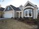 Charming home featuring a two-car garage and meticulously maintained front yard at 440 Shallowford Dr, Rock Hill, SC 29732