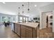 Spacious kitchen with stainless steel dishwasher, granite countertops, and dark wood cabinets at 440 Shallowford Dr, Rock Hill, SC 29732
