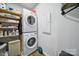 Convenient laundry room with stacked washer and dryer and ample shelving for storage at 440 Shallowford Dr, Rock Hill, SC 29732