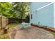 Backyard featuring a patio area, green lawn, flower bed and wood fence at 501 Mercury St, Charlotte, NC 28205