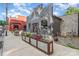 Charming gray brick building with outdoor seating and planters filled with colorful flowers at 501 Mercury St, Charlotte, NC 28205