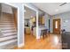 Hardwood floors connects the entry way to the kitchen via the living room and stairway at 501 Mercury St, Charlotte, NC 28205