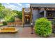 A quaint restaurant exterior with outdoor seating is seen with a cozy fire pit and welcoming entryway at 501 Mercury St, Charlotte, NC 28205