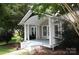 Charming home featuring a covered front porch with white pillars and blue painted steps at 510 5Th St, Spencer, NC 28159