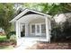 Charming home featuring a covered front porch with white pillars and painted steps at 510 5Th St, Spencer, NC 28159