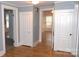 Hallway with hardwood floors connecting multiple rooms, offering space and classic charm at 510 5Th St, Spencer, NC 28159