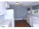 Functional kitchen with white appliances, ample counter space and hardwood flooring at 510 5Th St, Spencer, NC 28159