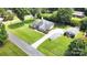 Expansive aerial view of a well-manicured property featuring a home, long driveway, and detached garage at 5701 Cedar Hill Dr, Monroe, NC 28110