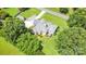 Aerial view of the home highlighting the back deck, lush landscaping, and ample green space at 5701 Cedar Hill Dr, Monroe, NC 28110
