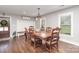 Charming dining room with hardwood floors, natural light, wainscotting and decorative furniture at 5701 Cedar Hill Dr, Monroe, NC 28110
