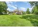 Expansive backyard with a charming single Gathering home, deck, mature trees and lots of lawn at 5701 Cedar Hill Dr, Monroe, NC 28110