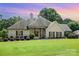 Charming single-story home with lush landscaping and a welcoming front porch at 5701 Cedar Hill Dr, Monroe, NC 28110