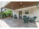 Charming covered patio with stained concrete, wood ceiling, and swing perfect for relaxing outdoors at 5701 Cedar Hill Dr, Monroe, NC 28110