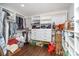 Walk-in closet with built-in shelving, drawers, and hardwood floors at 5701 Cedar Hill Dr, Monroe, NC 28110