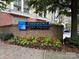 Piedmont Town Center sign with brick base and seasonal flower bed at 5730 Closeburn Rd # N, Charlotte, NC 28210