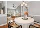 Dining area open to the living room, featuring modern furnishings and decor at 5730 Closeburn Rd # N, Charlotte, NC 28210