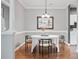 Dining room with neutral decor, hardwood floors, and modern chandelier at 5730 Closeburn Rd # N, Charlotte, NC 28210