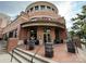 Brick building featuring Legion Brewing signage and an inviting entryway with benches and decorative barrels at 5730 Closeburn Rd # N, Charlotte, NC 28210