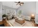 Bright living room with vaulted ceiling, natural light, and access to balcony at 5730 Closeburn Rd # N, Charlotte, NC 28210