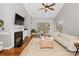 Cozy living room with fireplace, vaulted ceiling, and neutral decor at 5730 Closeburn Rd # N, Charlotte, NC 28210