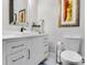 Well-lit powder bathroom with modern vanity, vessel sink and updated fixtures at 6327 Fox Tail Ln, Davidson, NC 28036