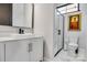 Updated bathroom with modern vanity, vessel sink, walk-in shower with glass enclosure and marble floors at 6327 Fox Tail Ln, Davidson, NC 28036