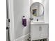 Modern powder room with a vessel sink, and round mirror at 6327 Fox Tail Ln, Davidson, NC 28036