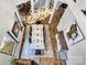 Aerial view of a dining room featuring an ornate chandelier and hardwood floors at 6327 Fox Tail Ln, Davidson, NC 28036