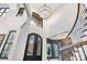 Impressive two-story foyer with modern lighting and a wrought iron front door at 6327 Fox Tail Ln, Davidson, NC 28036