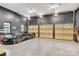 Spacious garage with epoxy floors, decorative doors and space for storage at 6327 Fox Tail Ln, Davidson, NC 28036