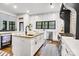 Bright kitchen featuring an island with seating and stainless steel appliances at 6327 Fox Tail Ln, Davidson, NC 28036