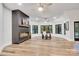 Bright living room with fireplace, offering plenty of natural light through large windows and a cozy atmosphere at 6327 Fox Tail Ln, Davidson, NC 28036