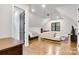 Open living space with wood floors, natural light, and versatile layout for living and relaxing at 6327 Fox Tail Ln, Davidson, NC 28036