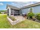 A cozy patio area with a screened porch, perfect for outdoor dining and enjoying the serene backyard at 732 Wood Lily Dr, Belmont, NC 28012