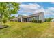 Spacious backyard with lush green grass, and screened-in porch, perfect for outdoor activities at 732 Wood Lily Dr, Belmont, NC 28012