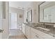 Bathroom featuring double sinks with granite countertops, wood floors, and white cabinets at 732 Wood Lily Dr, Belmont, NC 28012