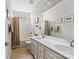 Well-lit bathroom with double vanity, tub and shower combination, and neutral décor at 732 Wood Lily Dr, Belmont, NC 28012