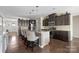 Spacious kitchen with a large island, bar seating, and modern stainless steel appliances at 732 Wood Lily Dr, Belmont, NC 28012
