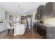 Beautiful kitchen with dark wood and white cabinets, stainless steel appliances, granite countertops, and hardwood floors at 732 Wood Lily Dr, Belmont, NC 28012